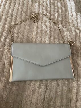 Madison West Elegant Light Grey Envelope Crossbody Bag with Gold Chain. NWOT